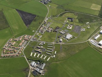 Oblique aerial view centred on the Domestic site, taken from the W.