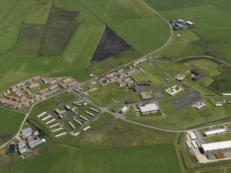 Oblique aerial view centred on the Domestic site, taken from the W.