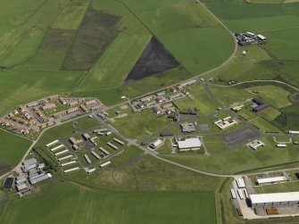 Oblique aerial view centred on the Domestic site, taken from the W.