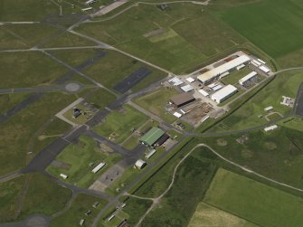 Oblique aerial view centred on the Technical area with the fabrication yard adjacent, taken from the ESE.