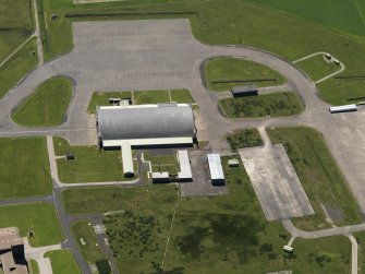 Oblique aerial view centred on the 'Gaydon' aircraft hangar, taken from the N.