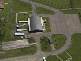 Oblique aerial view centred on the 'Gaydon' aircraft hangar, taken from the W.