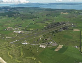 General oblique aerial view centred on the airfield, taken from the SW.