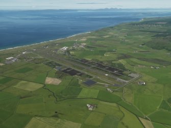 General oblique aerial view centred on the airfield, taken from the SE.