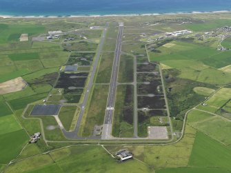 General oblique aerial view centred on the airfield, taken from the E.