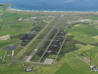 Oblique aerial view of Machrihanish Airfield, taken from the ENE.