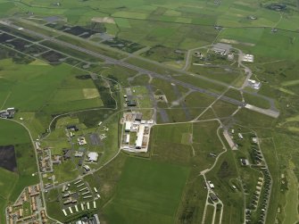 General oblique aerial view centred on the airfield, taken from the NNW.