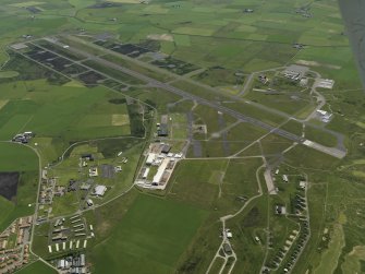 General oblique aerial view centred on the airfield, taken from the NNW.