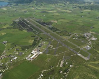 General oblique aerial view centred on the airfield, taken from the NW.