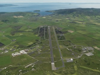 General oblique aerial view centred on the airfield, taken from the WNW.