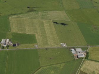 Oblique aerial view centred on the remains of the airfield, taken from the S.
