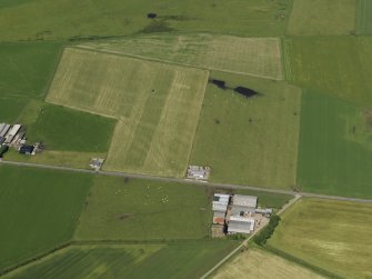 Oblique aerial view centred on the remains of the airfield, taken from the SSE.