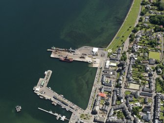 Oblique aerial view centred on the harbour, taken from the WNW.