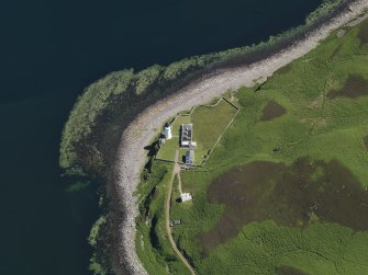 Oblique aerial view centred on the lighthouse with the observation tower adjjacent, taken from the W.