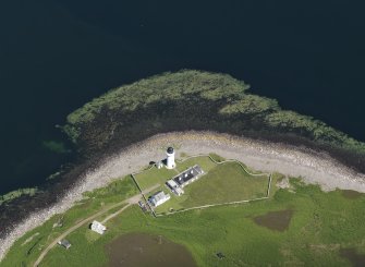 Oblique aerial view centred on the lighthouse with the observation tower adjjacent, taken from the SW.