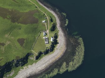 Oblique aerial view centred on the lighthouse with the observation tower adjjacent, taken from the E.