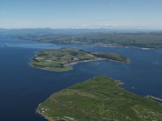 General oblique aerial view (distant) centred on the island, taken from the SW.