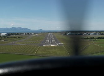 Oblique aerial view centred on the main runway, taken from the SE.