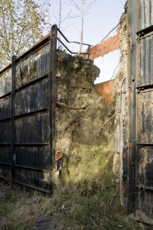 Detail of earthen bank with corrugated iron revetting surrounding switch house and steam strong point.