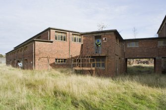 View from SSW of the charge forming house with the etxernal landing of the connecting corridor (2nd floor) to the charge forming and pumping house.