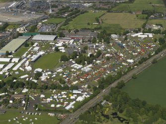 General oblique aerial view centred on the airport, taken from the SW.