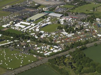 General oblique aerial view centred on the airport, taken from the SW.