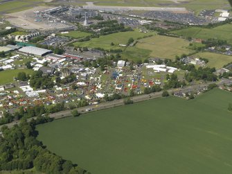 General oblique aerial view centred on the airport, taken from the SW.