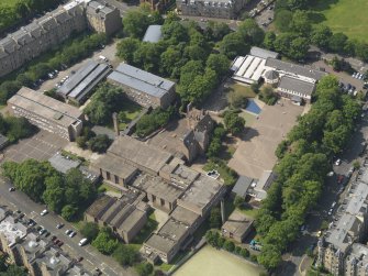 Oblique aerial view centred on Bruntisfield House with High School and Primary School adjacent, taken from the NE.