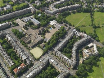 Oblique aerial view centred on Bruntisfield House with High School and Primary School adjacent, taken from the NE.