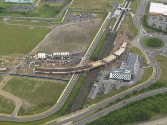 Oblique aerial view of the construction of the bridge on the Edinburgh Tram at Cultin's Road, Hermiston Gait, taken from the WSW.