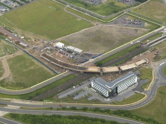 Oblique aerial view of the construction of the bridge on the Edinburgh Tram at Cultin's Road, Hermiston Gait, taken from the SW.