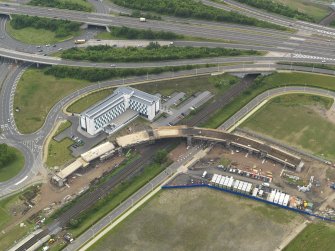 Oblique aerial view of the construction of the bridge on the Edinburgh Tram at Cultin's Road, Hermiston Gait, taken from the NE.