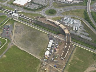 Oblique aerial view of the construction of the bridge on the Edinburgh Tram at Cultin's Road, Hermiston Gait, taken from the NW.