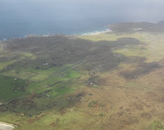 General oblique aerial view (distant) centred on the airfield, taken from the SE.