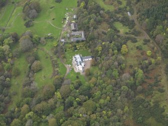 Oblique aerial view centred on the country house, taken from the SSE.