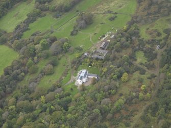 Oblique aerial view centred on the country house, taken from the E.