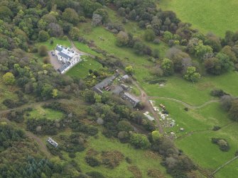 Oblique aerial view centred on the country house, taken from the N.