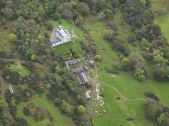 Oblique aerial view centred on the country house, taken from the NNW.