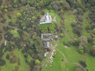 Oblique aerial view centred on the country house, taken from the NW.