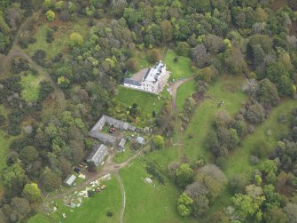 Oblique aerial view centred on the country house, taken from the WNW.