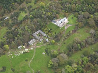 Oblique aerial view centred on the country house, taken from the SW.