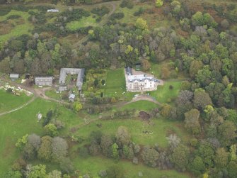 Oblique aerial view centred on the country house, taken from the SW.