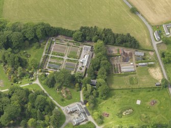 Oblique aerial view of Threave House stables and kitchen garden, taken from the ENE.