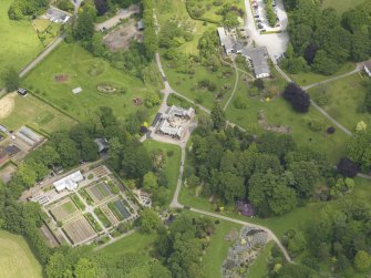 Oblique aerial view of Threave House stables and kitchen garden, taken from the SW.
