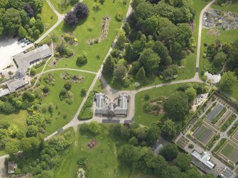 Oblique aerial view of Threave House stables and kitchen garden, taken from the NW.