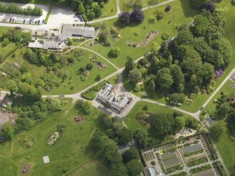 Oblique aerial view of Threave House stables and kitchen garden, taken from the WNW.