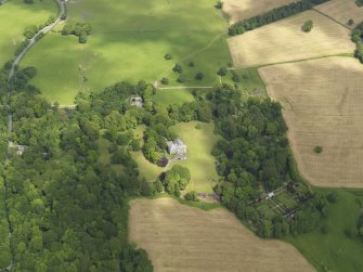 General oblique aerial view of Argrennan House and policies, taken from the SW.