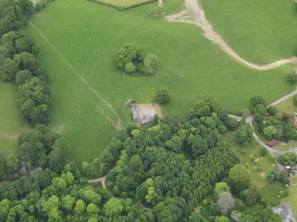 Oblique aerial view of Cumstoun House doocot, taken from the SSW.