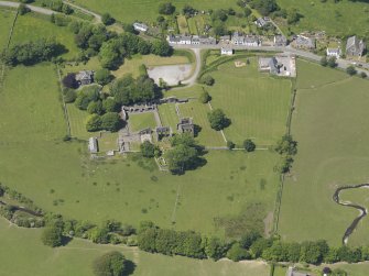 General oblique aerial view of Dundrennan Abbey, taken from the ESE.