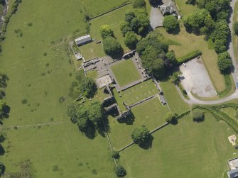 Oblique aerial view of Dundrennan Abbey, taken from the NE.